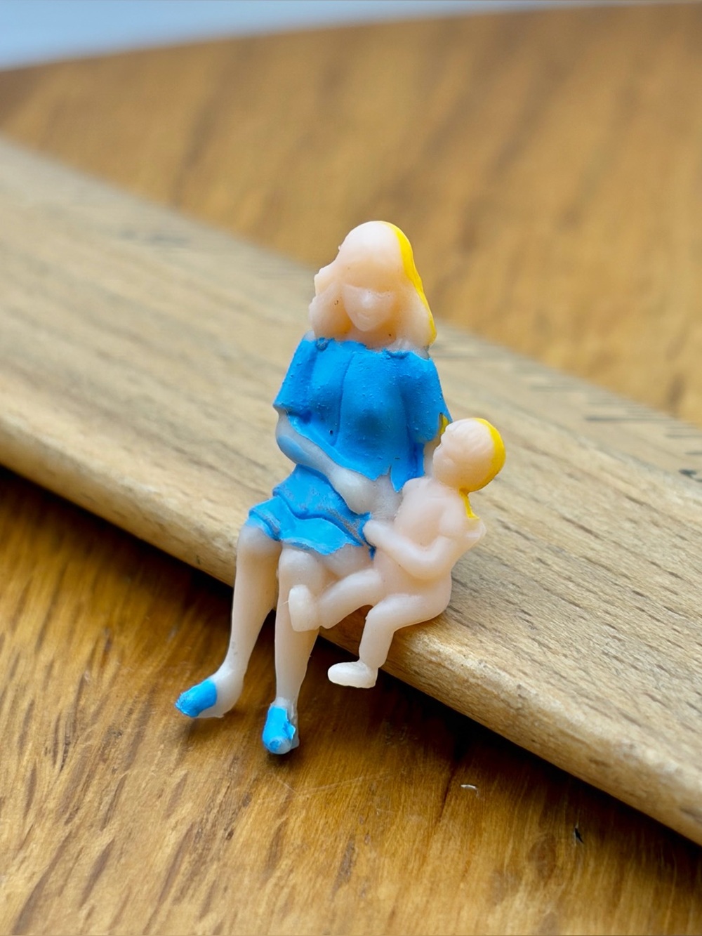 Vintage Plastic Celluloid Painted Woman Holding Child Figure Sitting Trinket 1”
